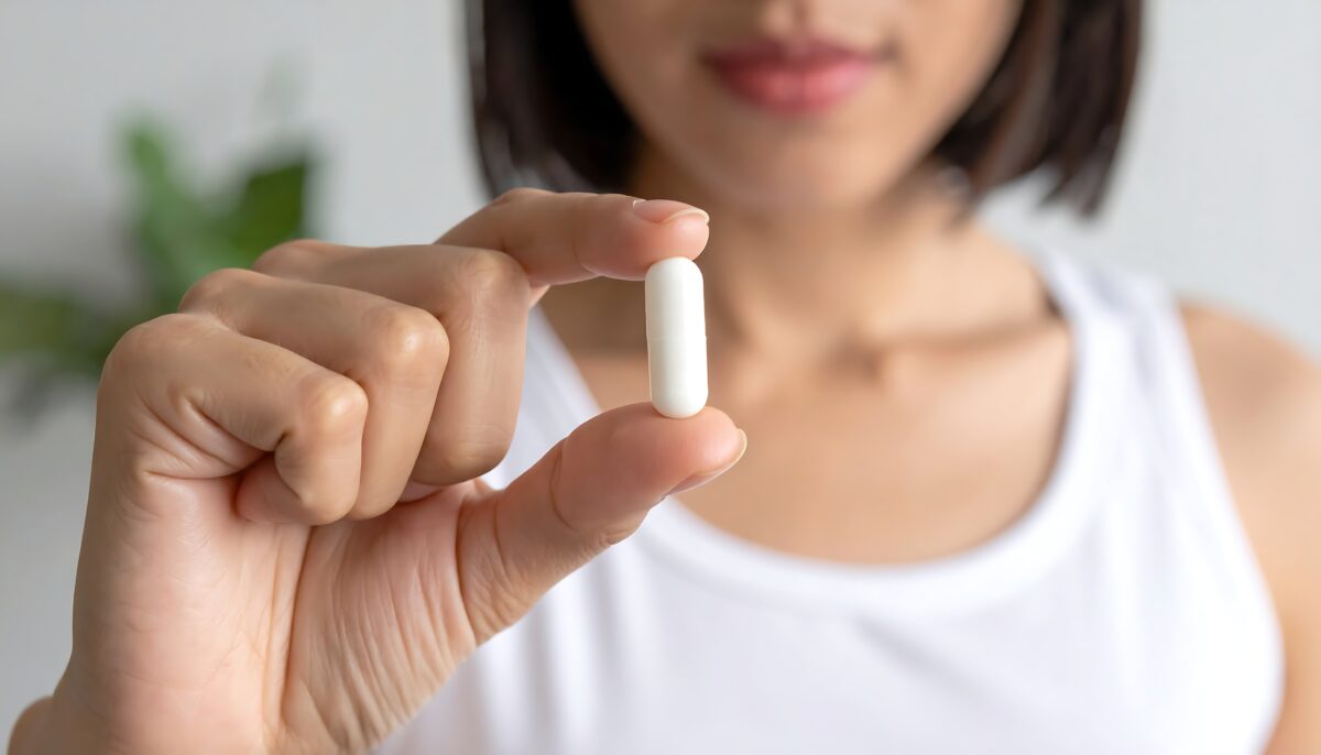 Women holding an Orforglipron oral GLP-1 capsule